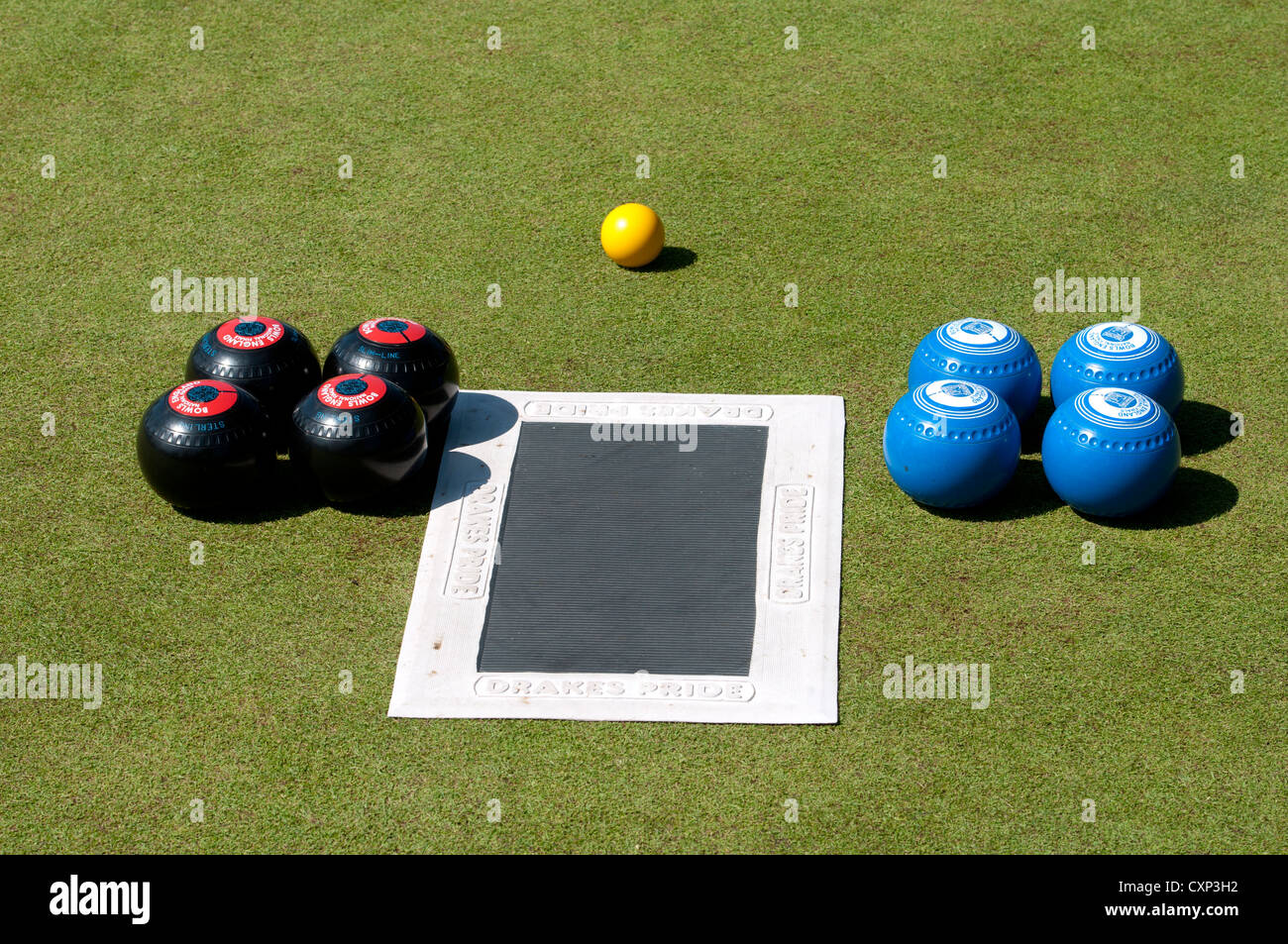 Lawn bowls and mat laid out before a match Stock Photo