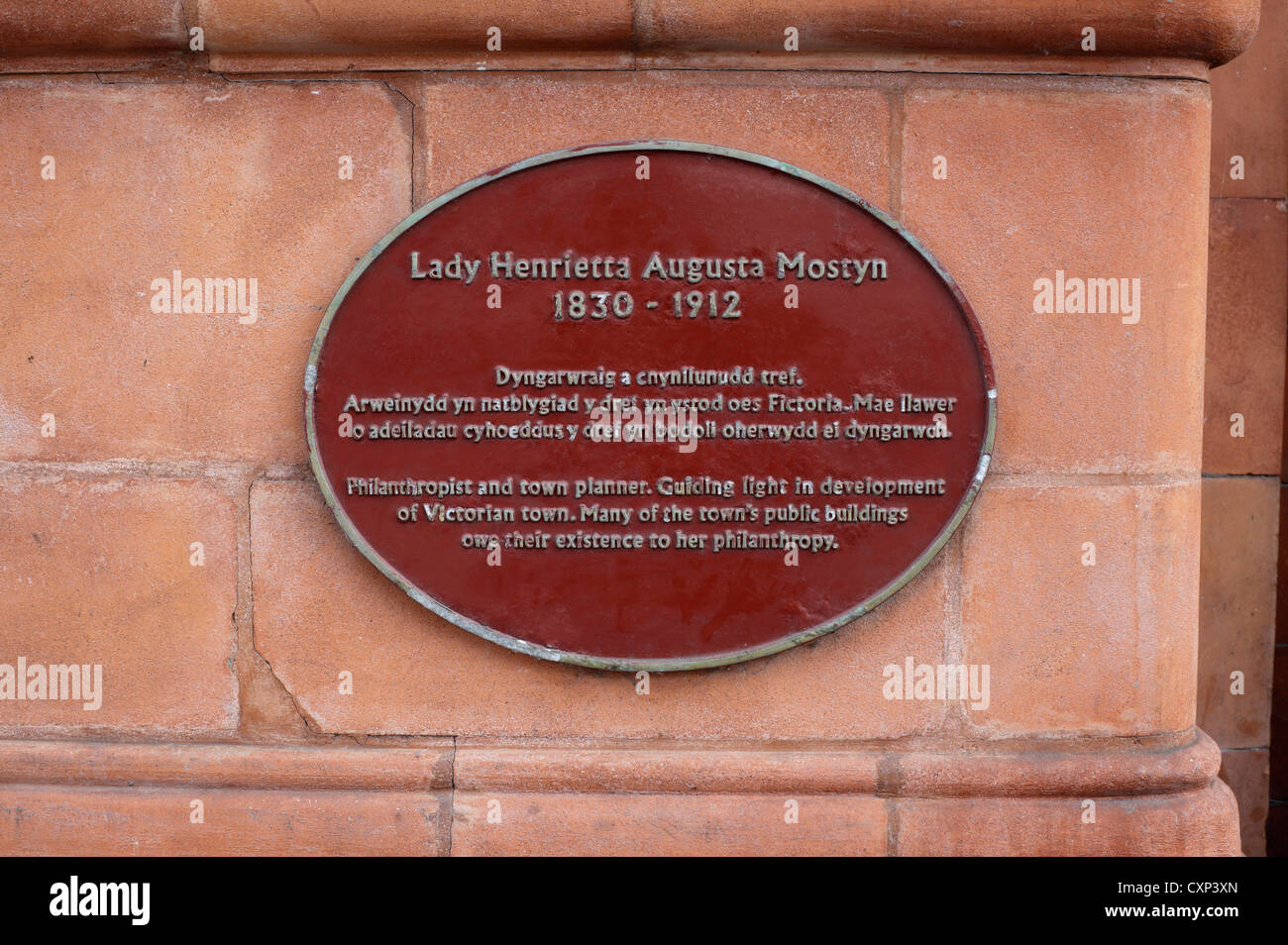 Metal plaque commemorating philanthropist Lady Henrietta Mostyn on a wall outside the Mostyn Gallery, Vaughan Street, Llandudno. Stock Photo
