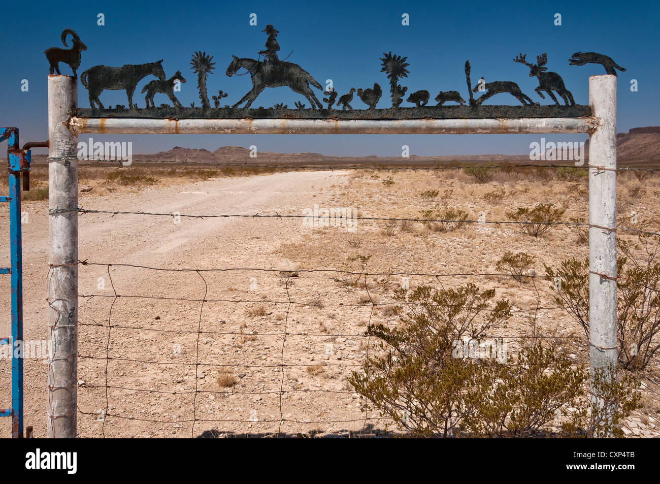 Wrought iron sign at ranch entrance in Chihuahuan Desert near Alpine ...