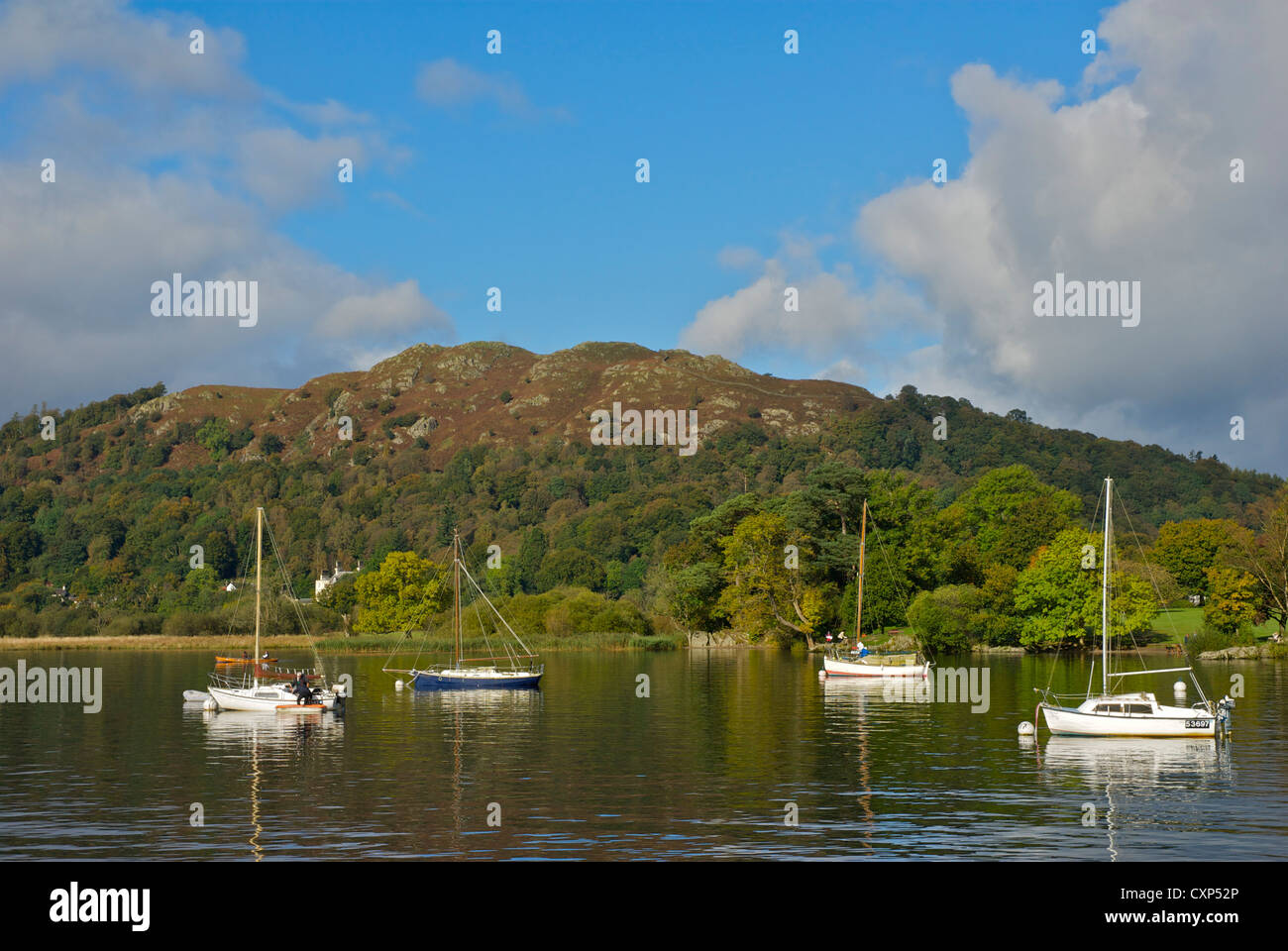 Sailing boats moored on Lake Windermere at Waterhead, with Loughrigg