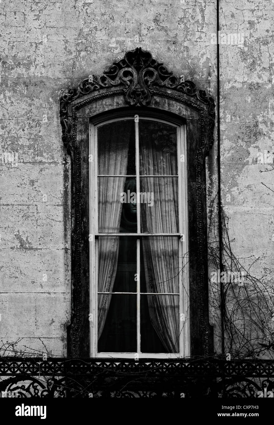 Ghost in the window Stock Photo
