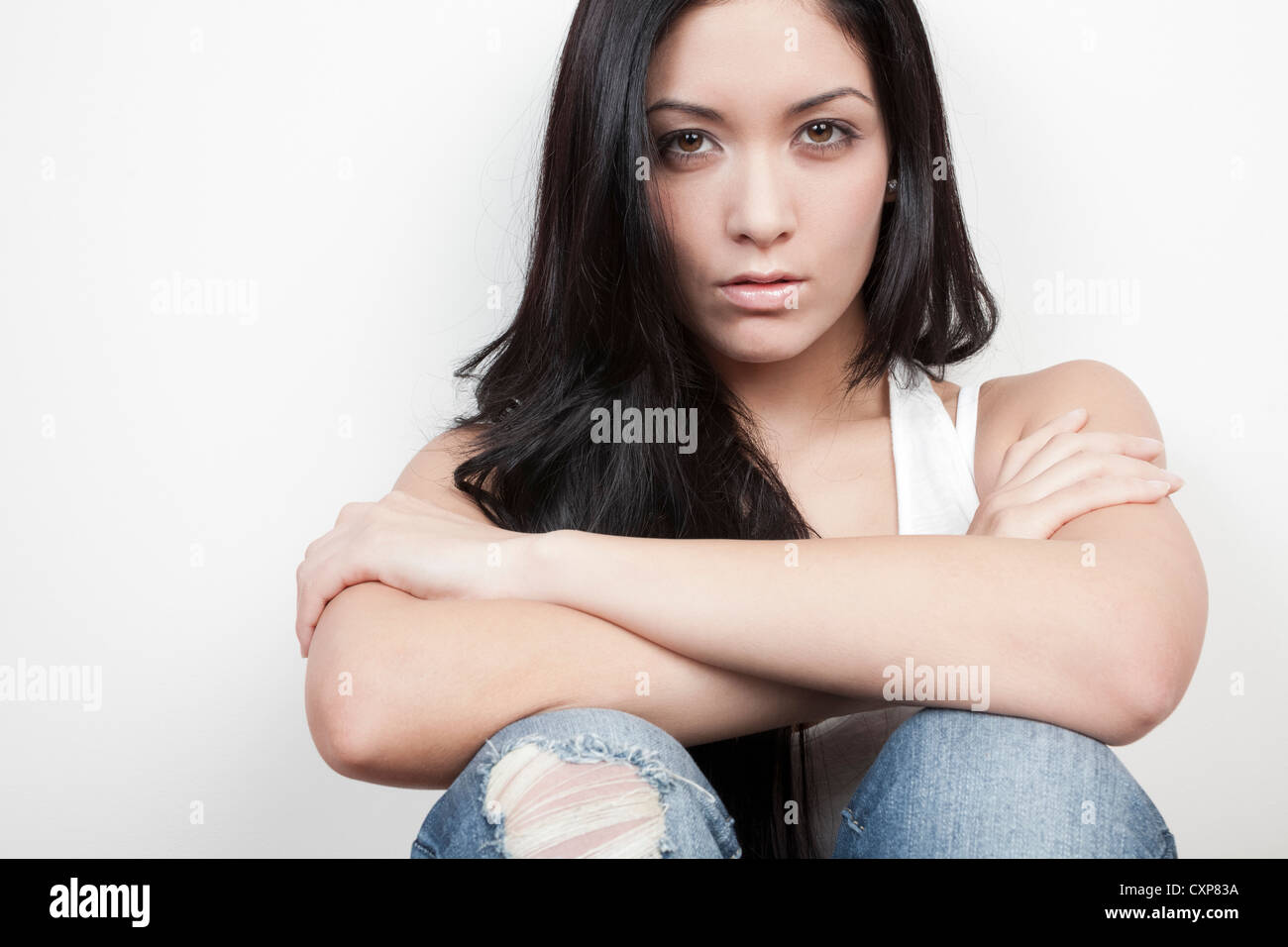 Angry woman with her arms folded, crossed Stock Photo