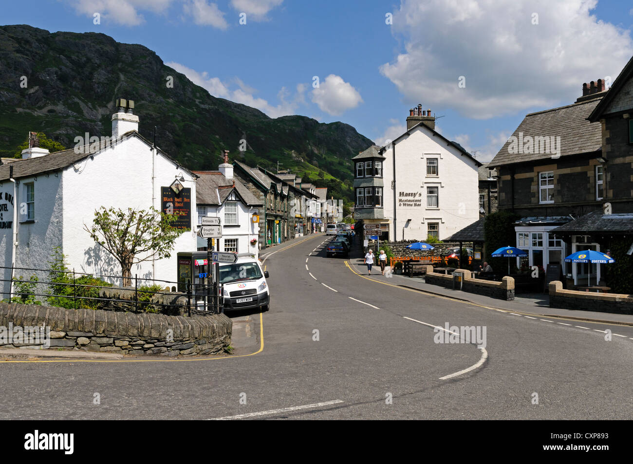 The picturesque Victorian mining village of Coniston set in the Lake District under the towering crags of Coniston Old Man Stock Photo