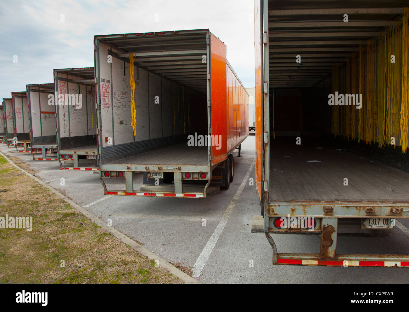 Empty trailers at a trucking depot Stock Photo - Alamy