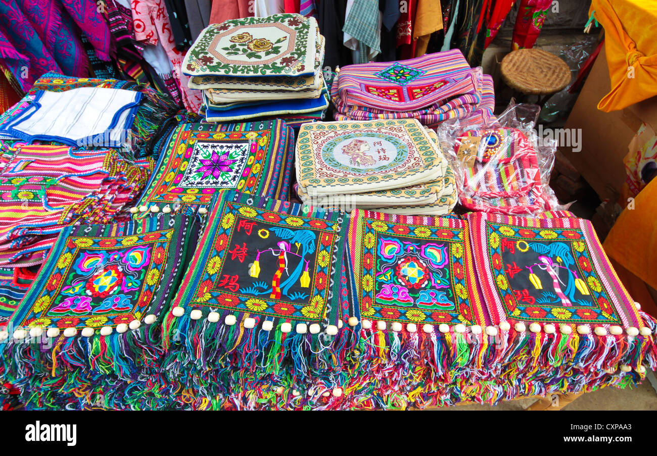 Garment stall selling various chinese clothings at Kunming Shilin, Yunnan China. Stock Photo