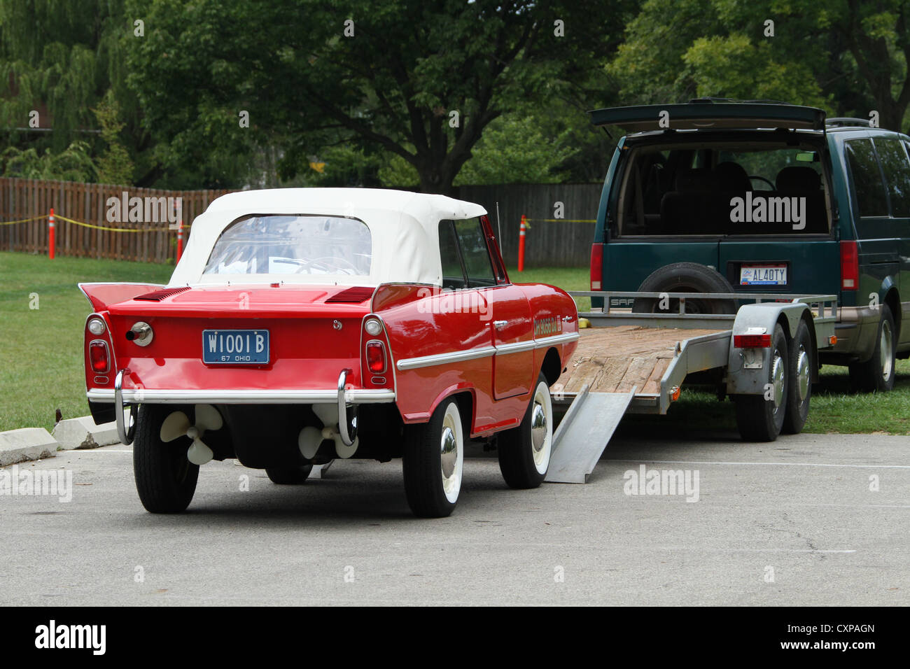 Auto- 1967 Amphicar. Red amphibious car that is also a boat. Ready to load on trailer. Stock Photo