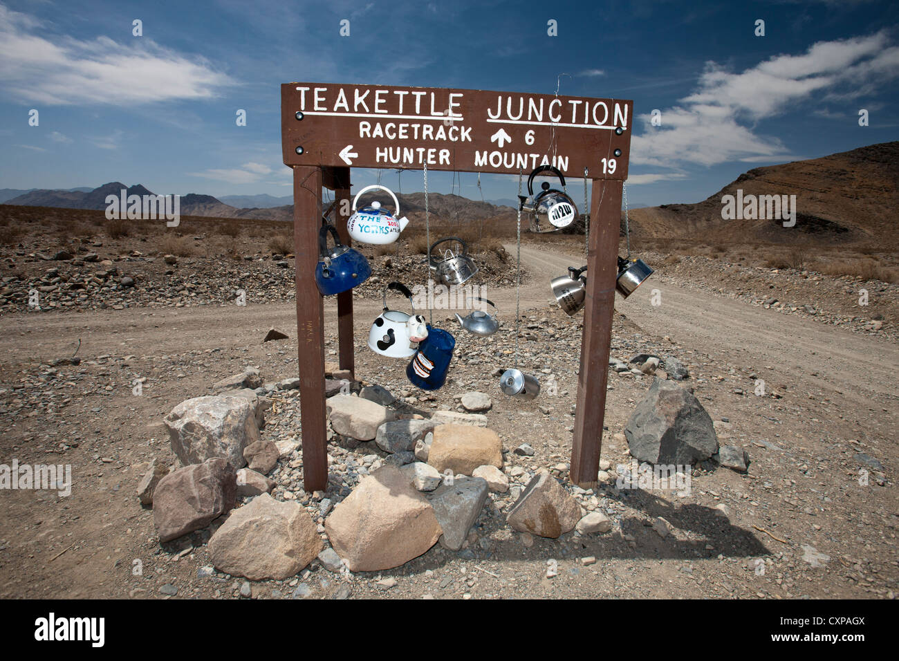 Teakettle Junction sign with tea kettles hanging, Death Valley National Park, California, United