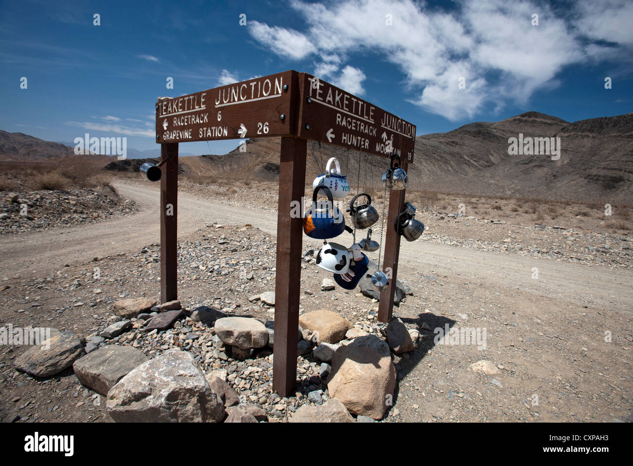 Teakettle Junction sign with tea kettles hanging, Death Valley National Park, California, United