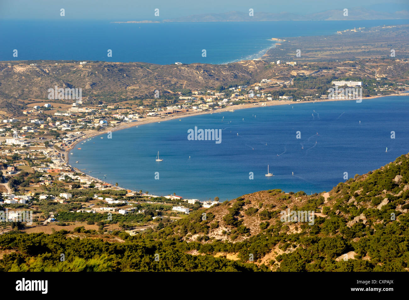 Kamari bay, village of Kamari looking across isthmus of Kos Island to Kalimos Island, Greece Stock Photo