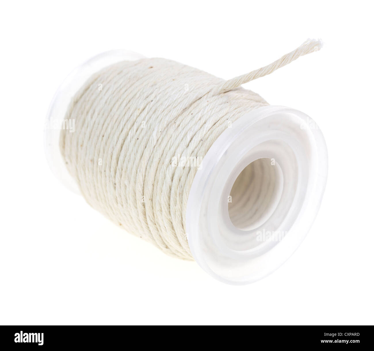 A spindle of new butcher's cotton twine on a white background. Stock Photo