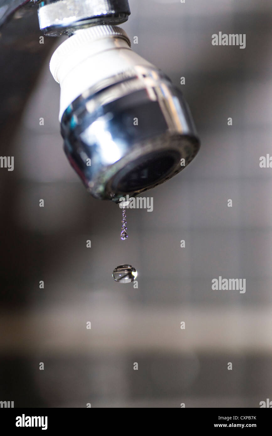 Old tap dripping water drops Stock Photo