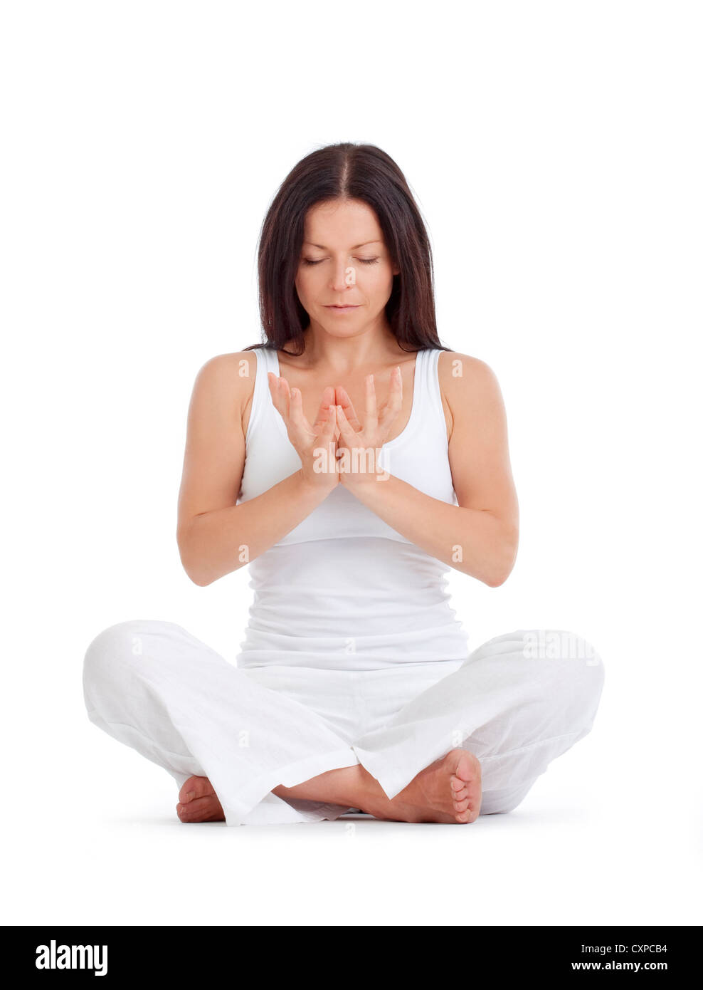 woman sitting on the floor exercising yoga - isolated on white Stock ...