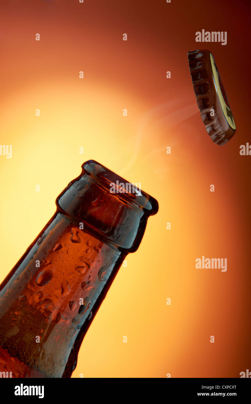 Beer bottle opening Stock Photo