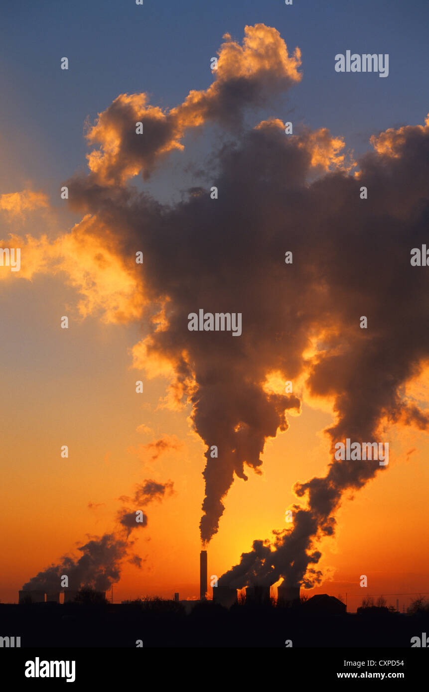 steam rising from chimneys at drax coal powered power station at sunset Yorkshire UK Stock Photo