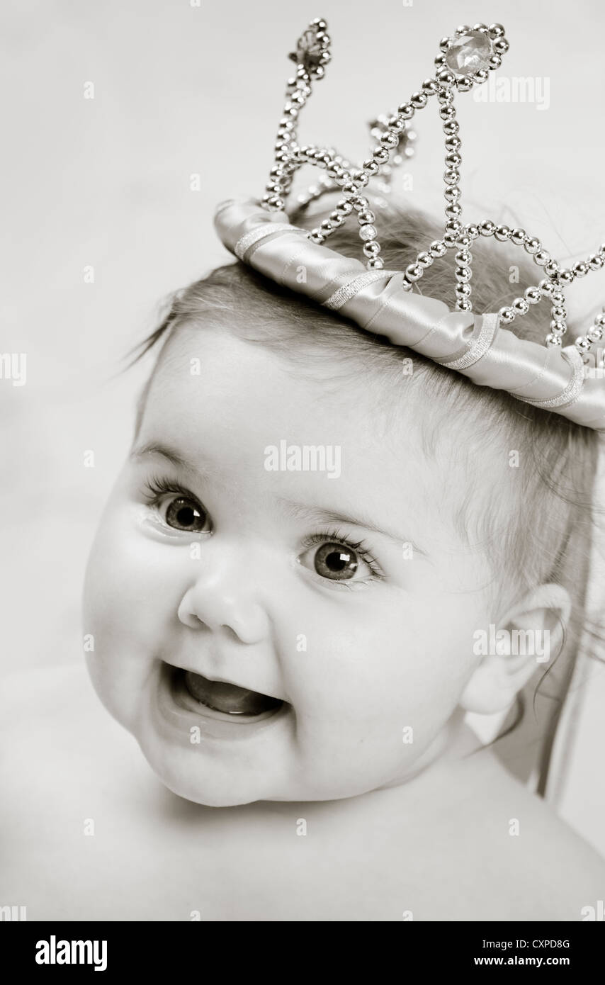 Closeup of a beautiful 6 month old baby wearing a princess crown. Stock Photo
