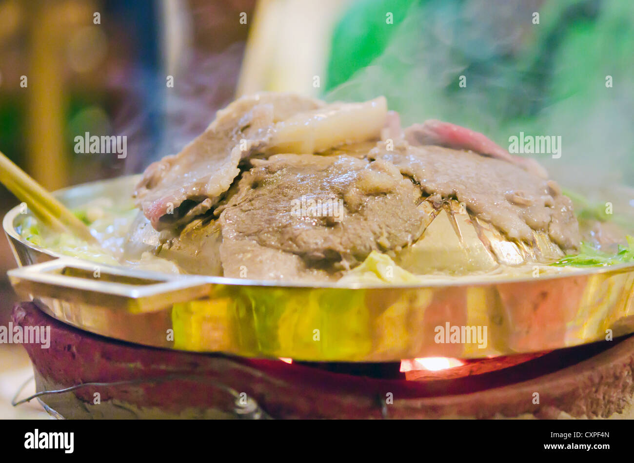 meat are being cooked on stove , Korean barbecue Stock Photo