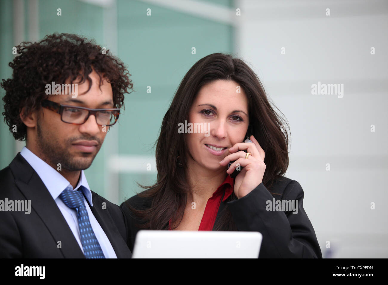 Closeup of a business couple standing outside Stock Photo - Alamy