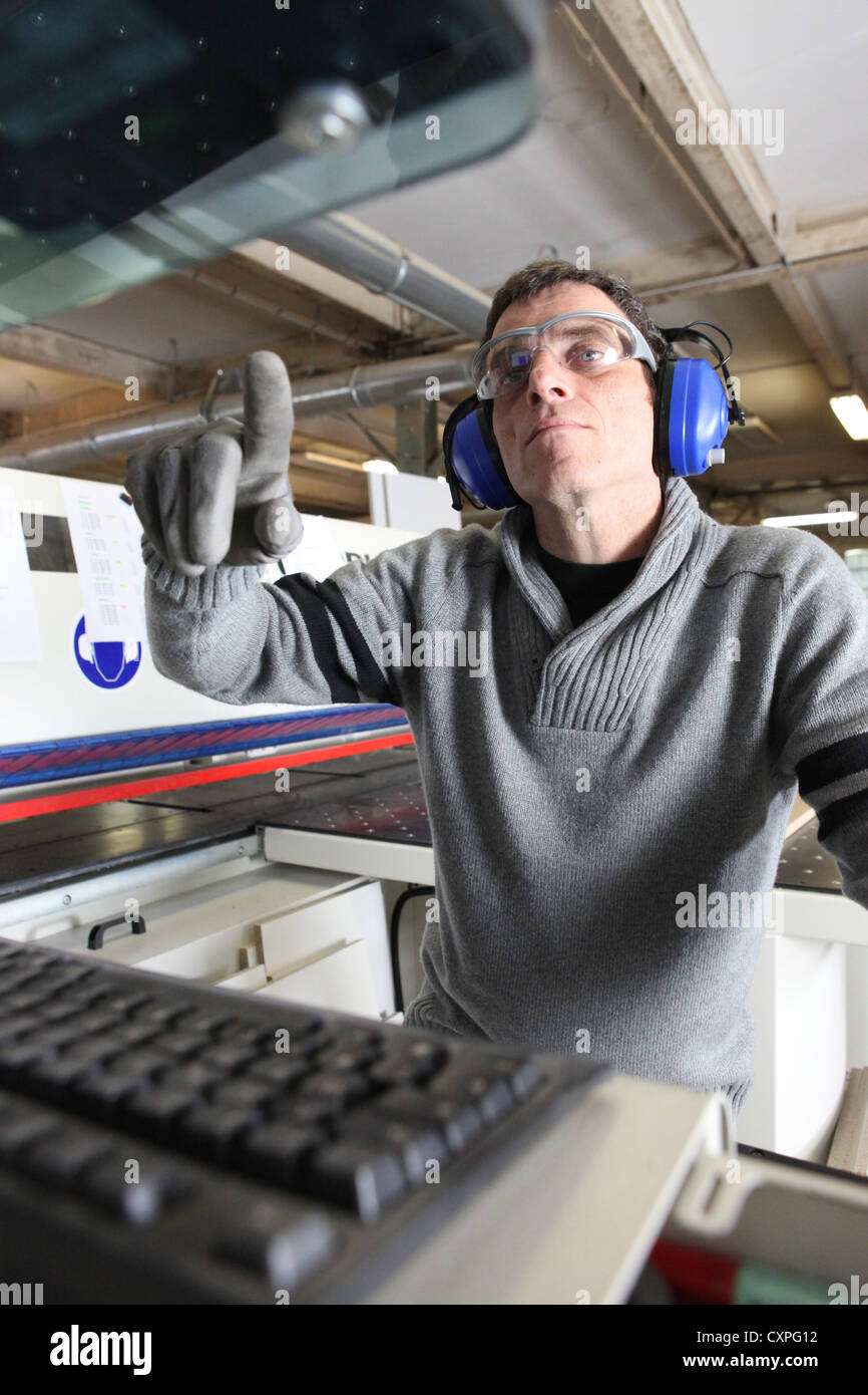 Man using computer controlled factory machine Stock Photo - Alamy