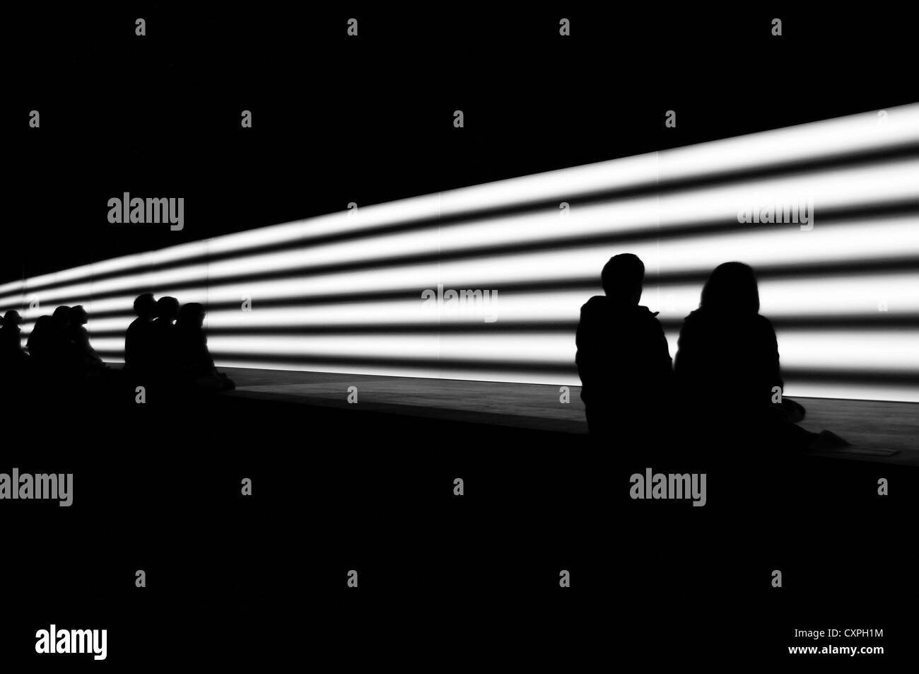 People observing streaks of light Stock Photo