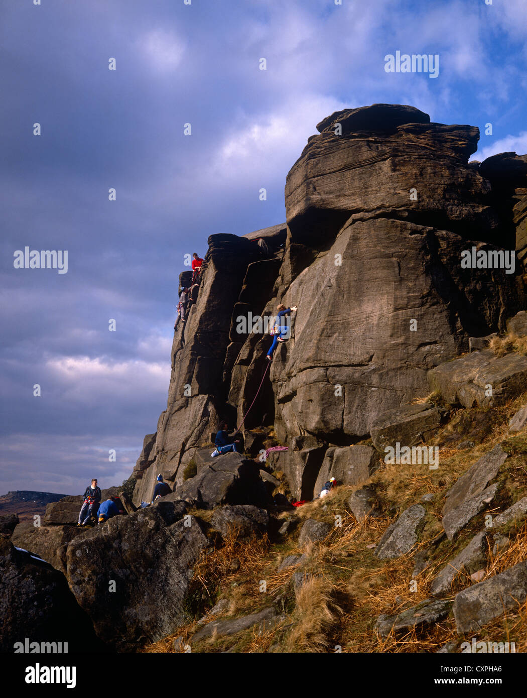 Rock climbing, Stanage Edge, near Hathersage, Derbyshire, UK Stock Photo
