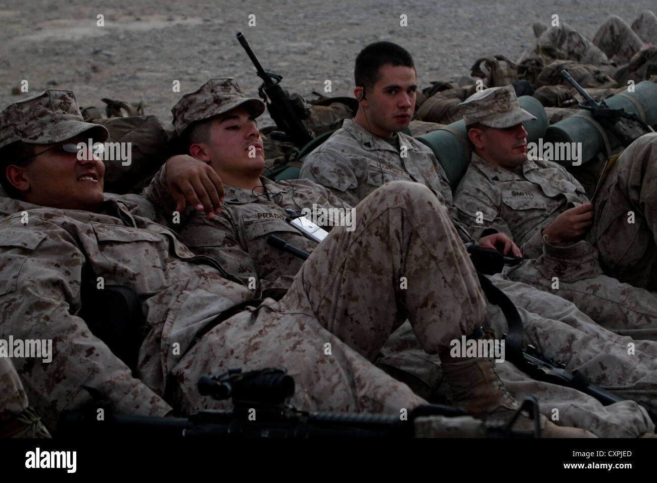 Marines with 1st Battalion, 7th Marines, Regimental Combat Team 6, relax while waiting to return home after a seven-month deployment, Sept. 25, 2012. The battalion deployed to Sangin, Afghanistan, during the summer fighting season. Stock Photo