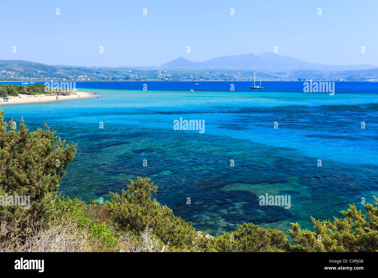 Beautiful sea waters of Voidokilia in Messinia prefecture with Pilos in the background Stock Photo