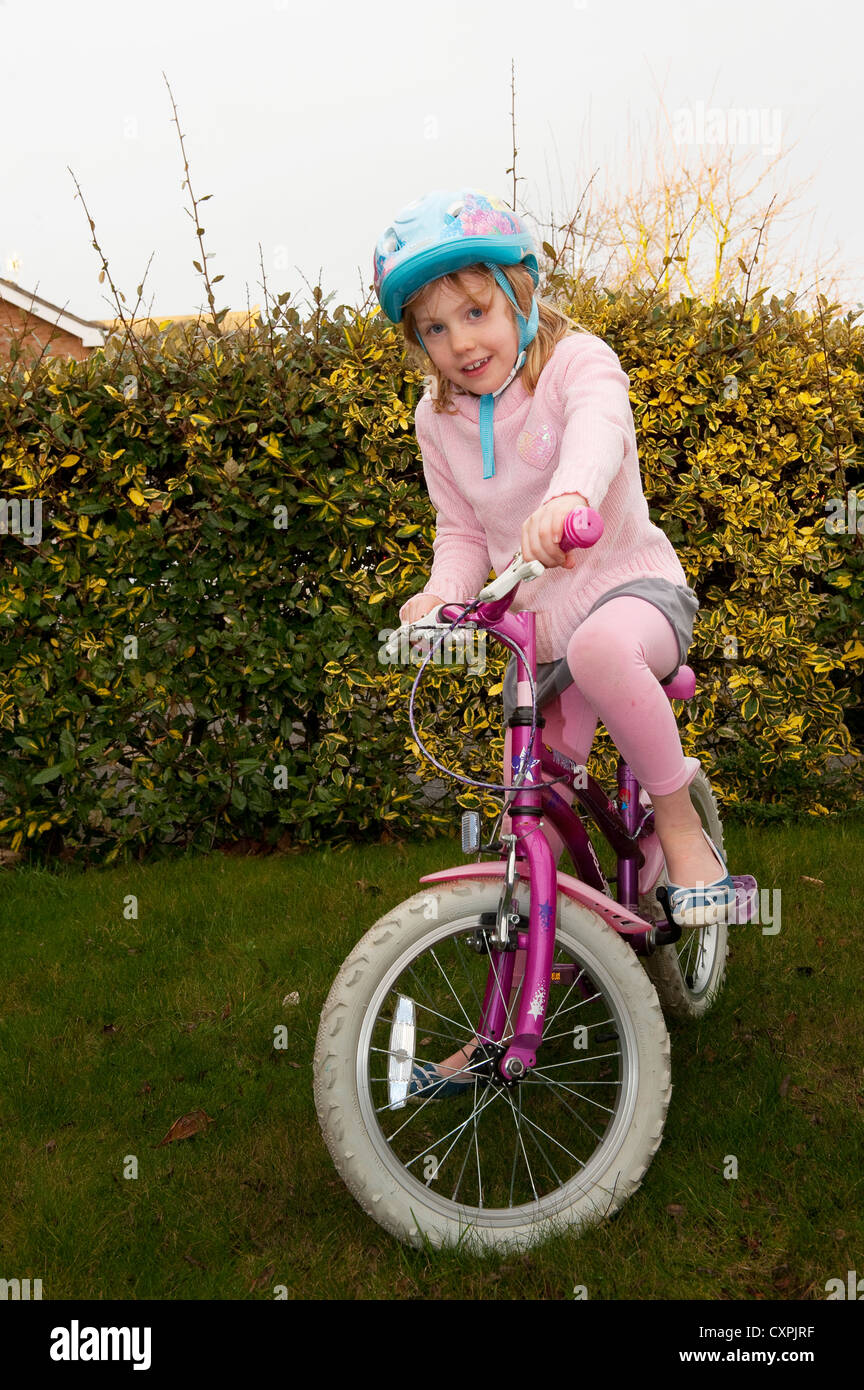 Child riding a bicycle. Stock Photo
