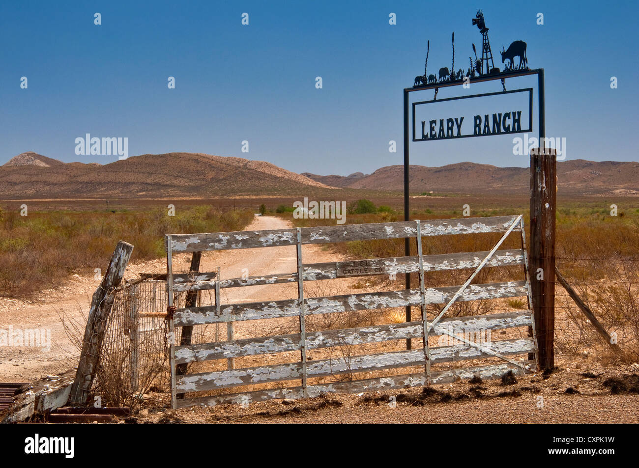 Wrought iron sign at road to ranch in Chihuahuan Desert near Marathon ...