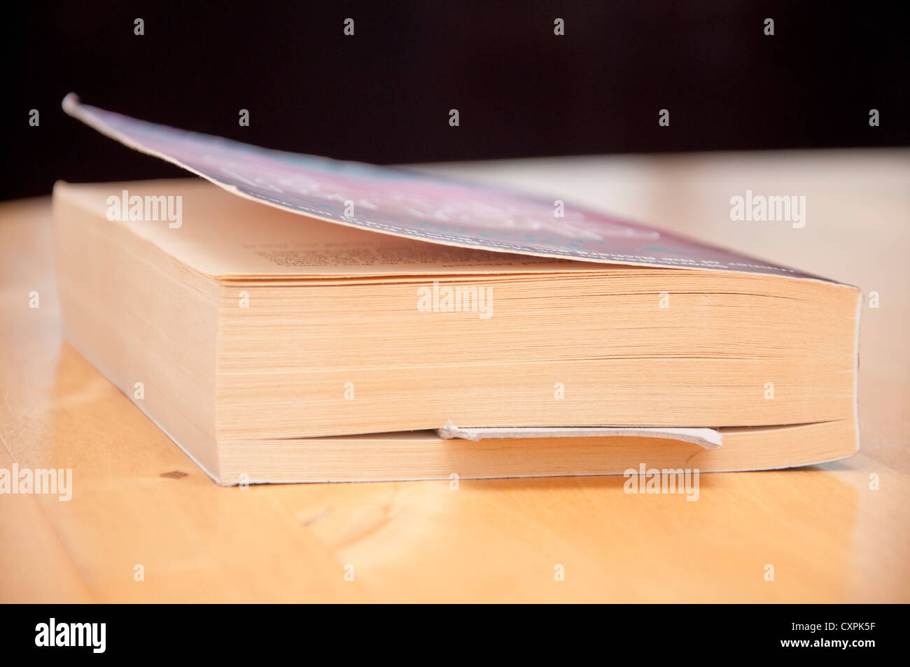 Place in book saved with a scarp of card as a bookmark. Stock Photo