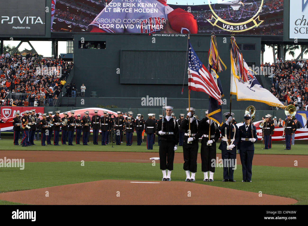 The colorguard and 1st Marine Division Band from Camp Pendleton, Calif., present the colors before the start of the San Francisco Giants game at AT&T park, Oct. 6. Stock Photo