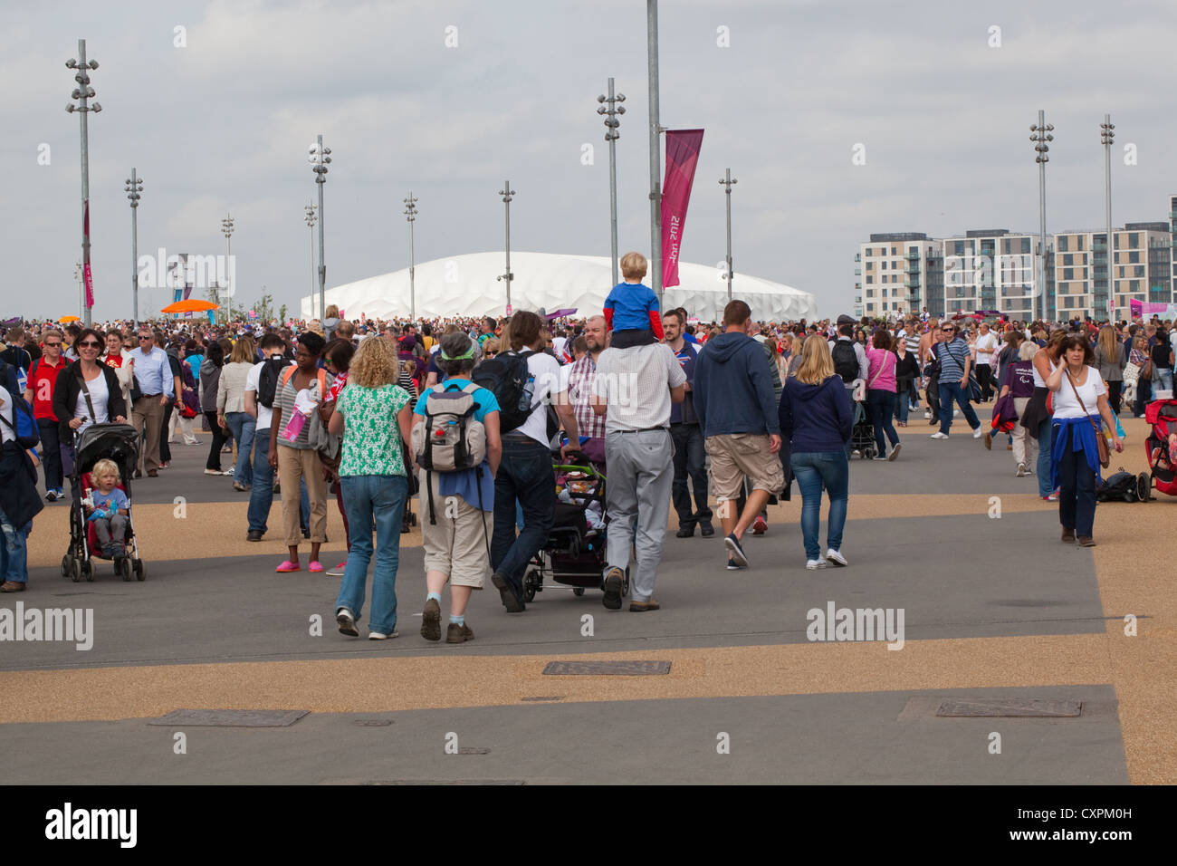 People (Homo sapiens). Crowds. Walking around Olympic Park. London. England. UK Stock Photo