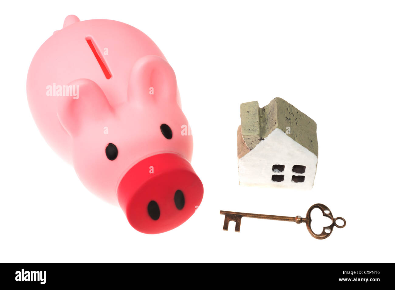 Piggy bank, key and house model isolated on white Stock Photo