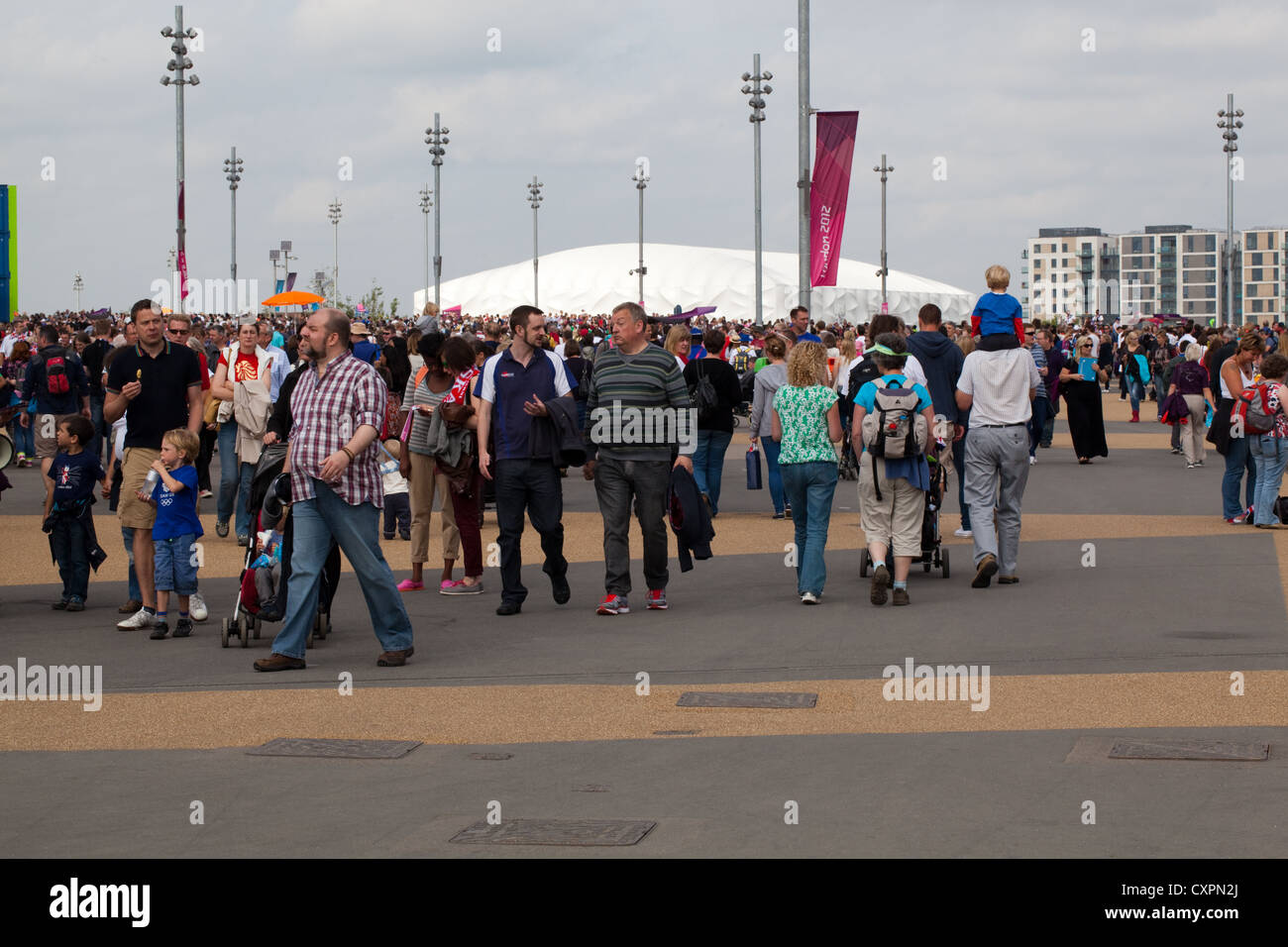 People (Homo sapiens). Crowds. Walking around Olympic Park. London. England. UK Stock Photo