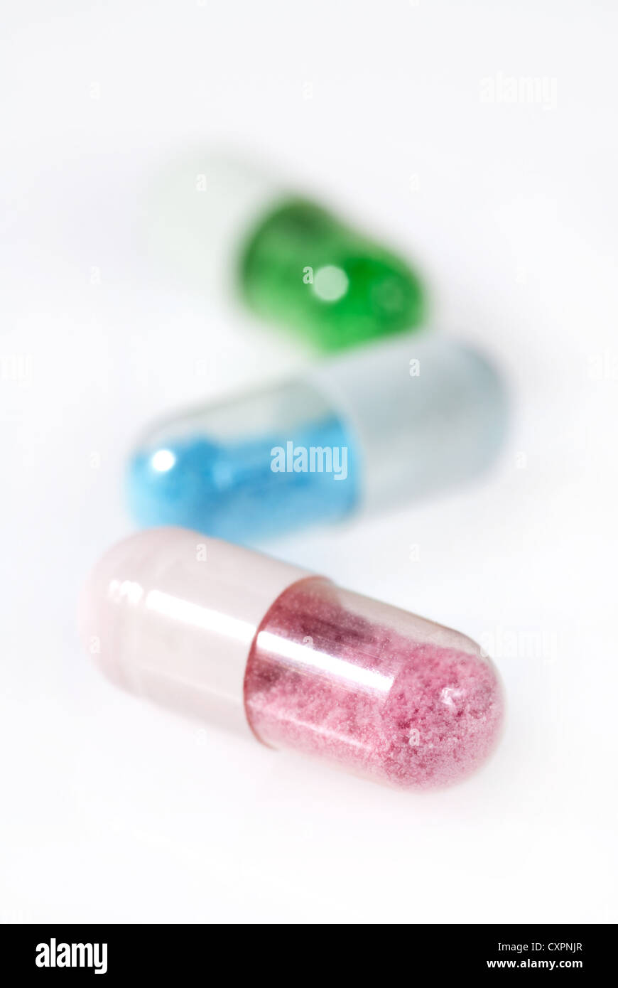 Pill capsules with an artificial and toxic looking content Stock Photo