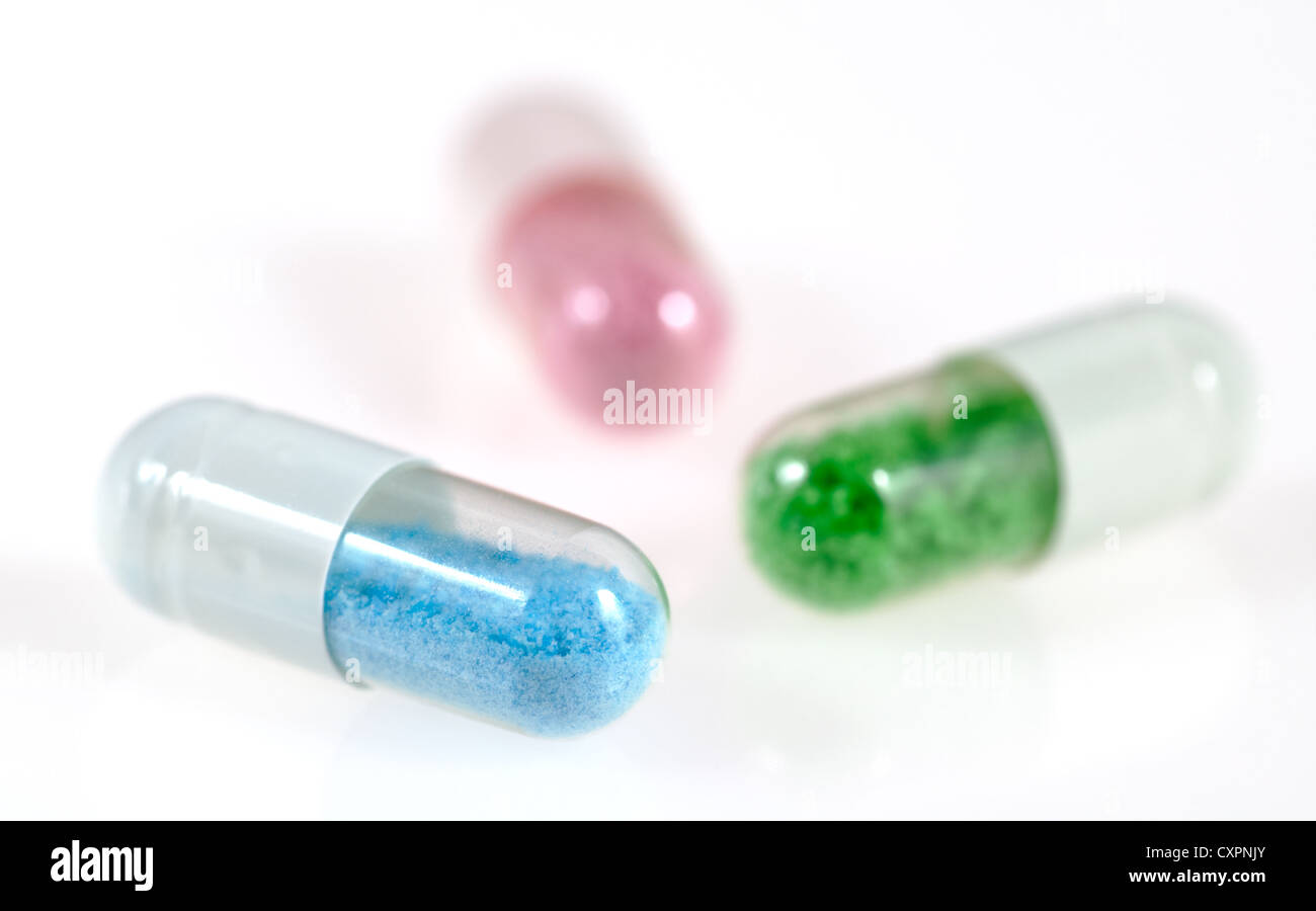 Pill capsules with an artificial and toxic looking content Stock Photo