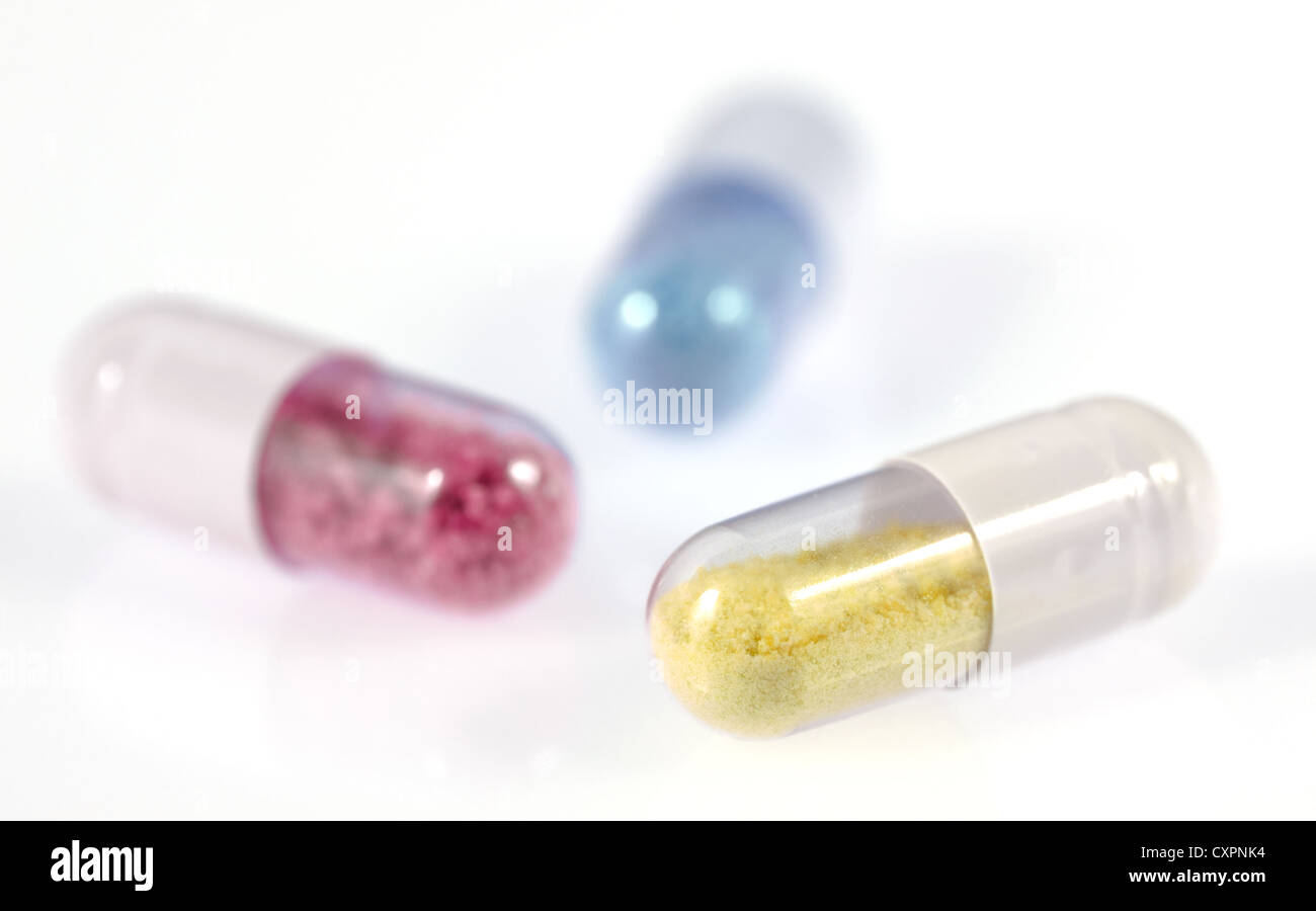 Pill capsules with an artificial and toxic looking content Stock Photo