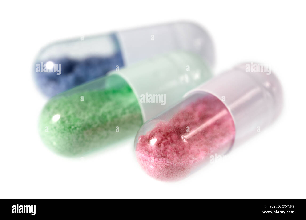 Pill capsules with an artificial and toxic looking content Stock Photo