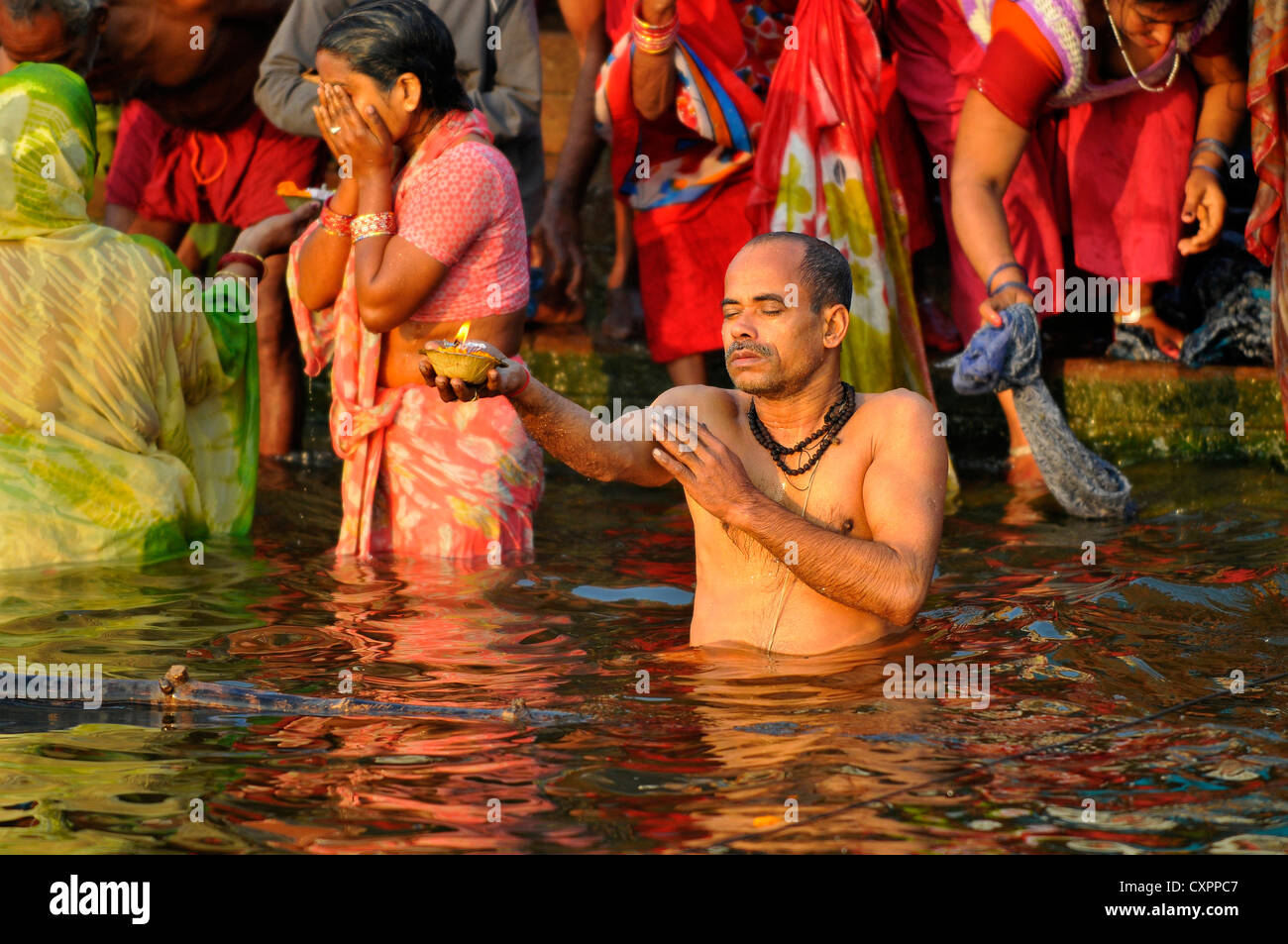 Asia  India Varanasi  Uttar Pradesh A dip in the holy waters of the River Ganges Stock Photo