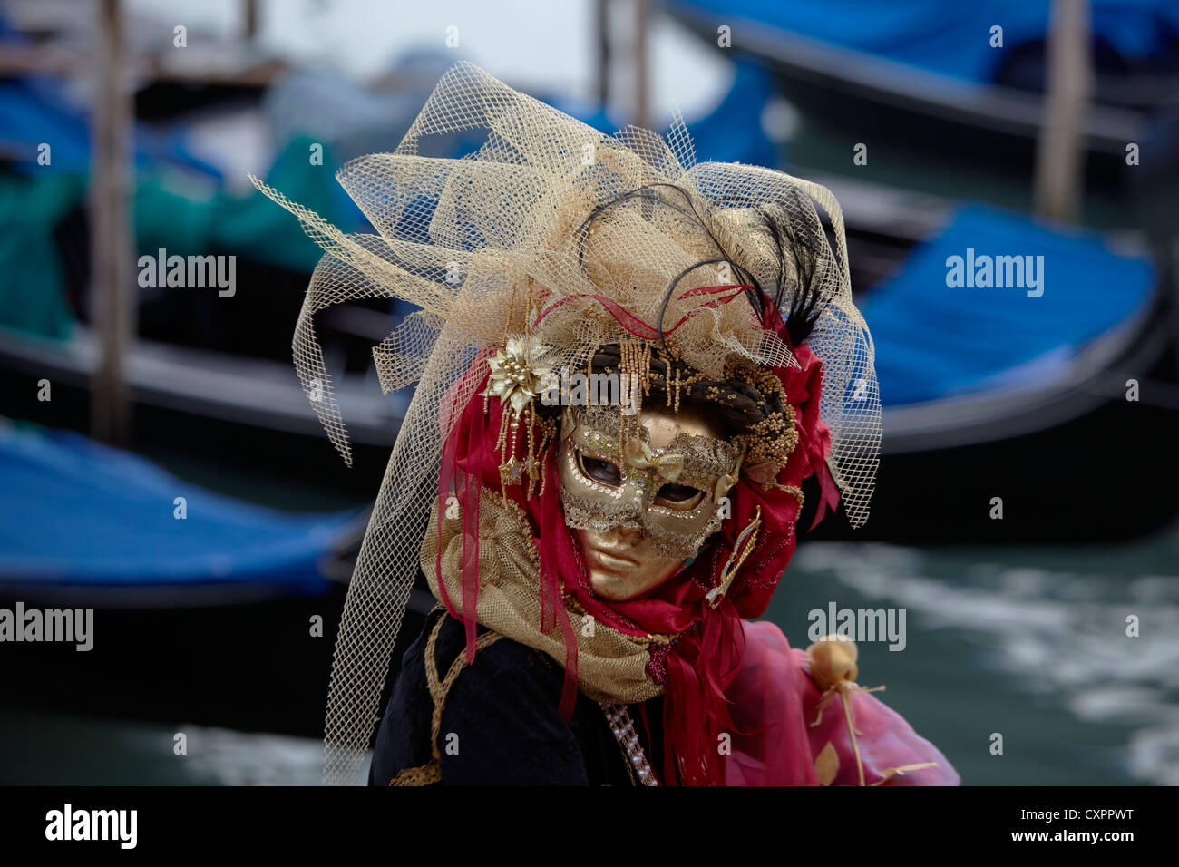 Carnival Masquerade in front of Gondolas Stock Photo