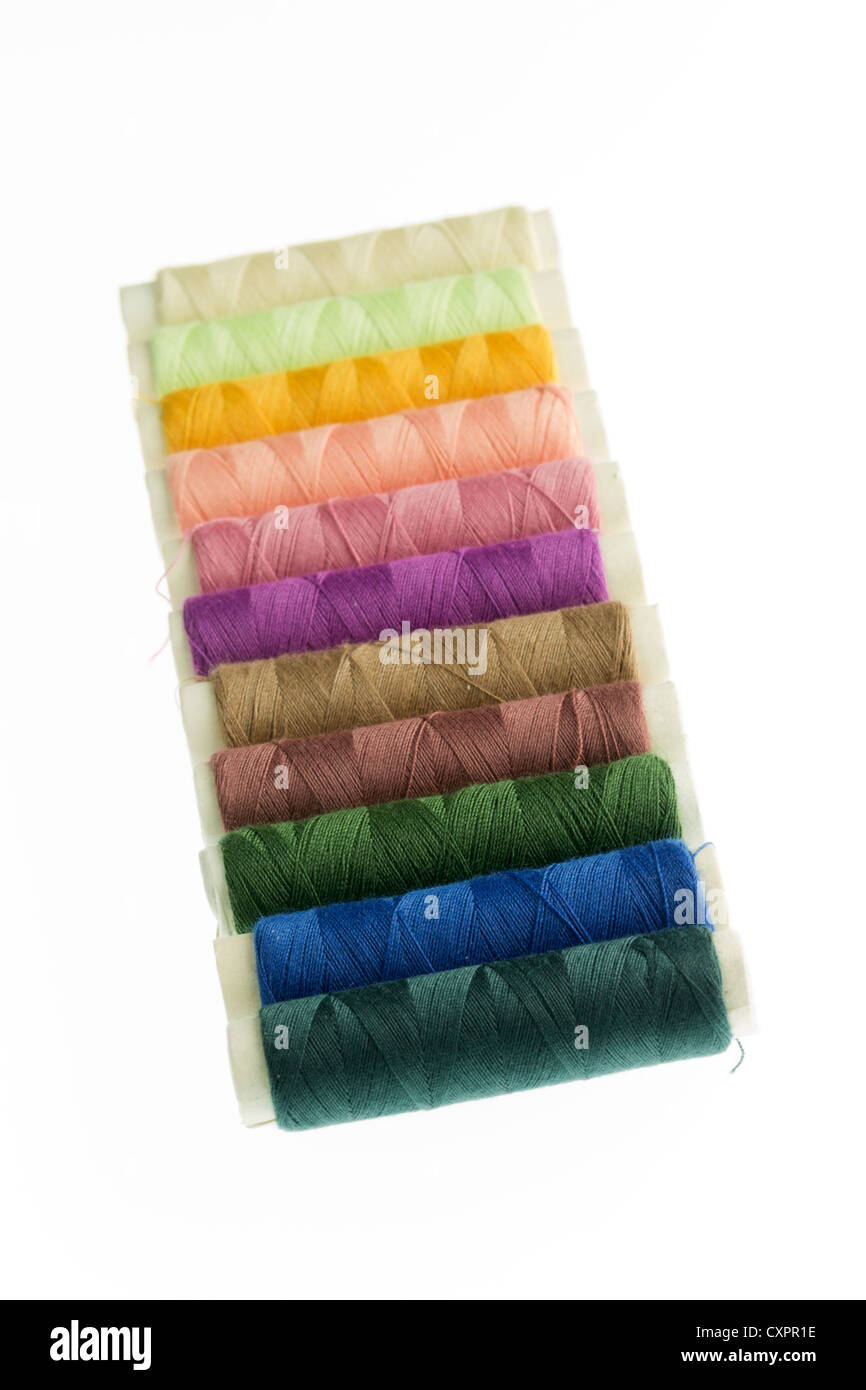 Row of reels of coloured polyester thread Stock Photo