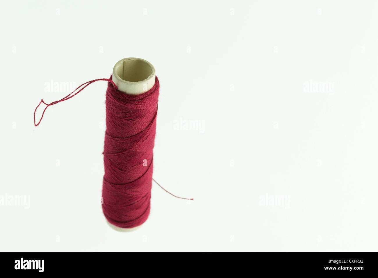 Reel or red polyester thread Stock Photo