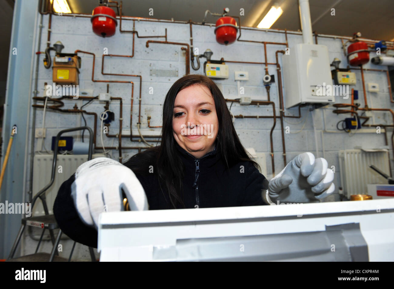 Apprentice working for a Gas Power Company training to be a technician Stock Photo