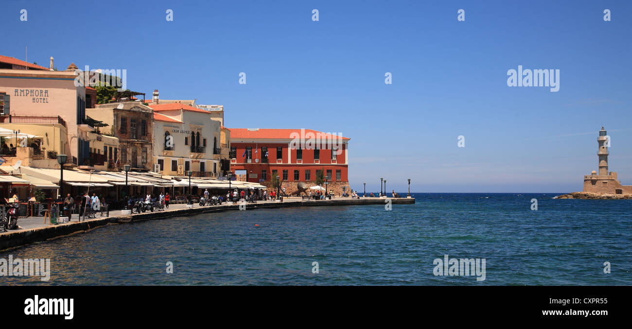 Harbour/harbor shops and cafe, Nautical Museum and Venetian lighthouse, Hania/Chania, Crete, Cyclades, Greece, Stock Photo