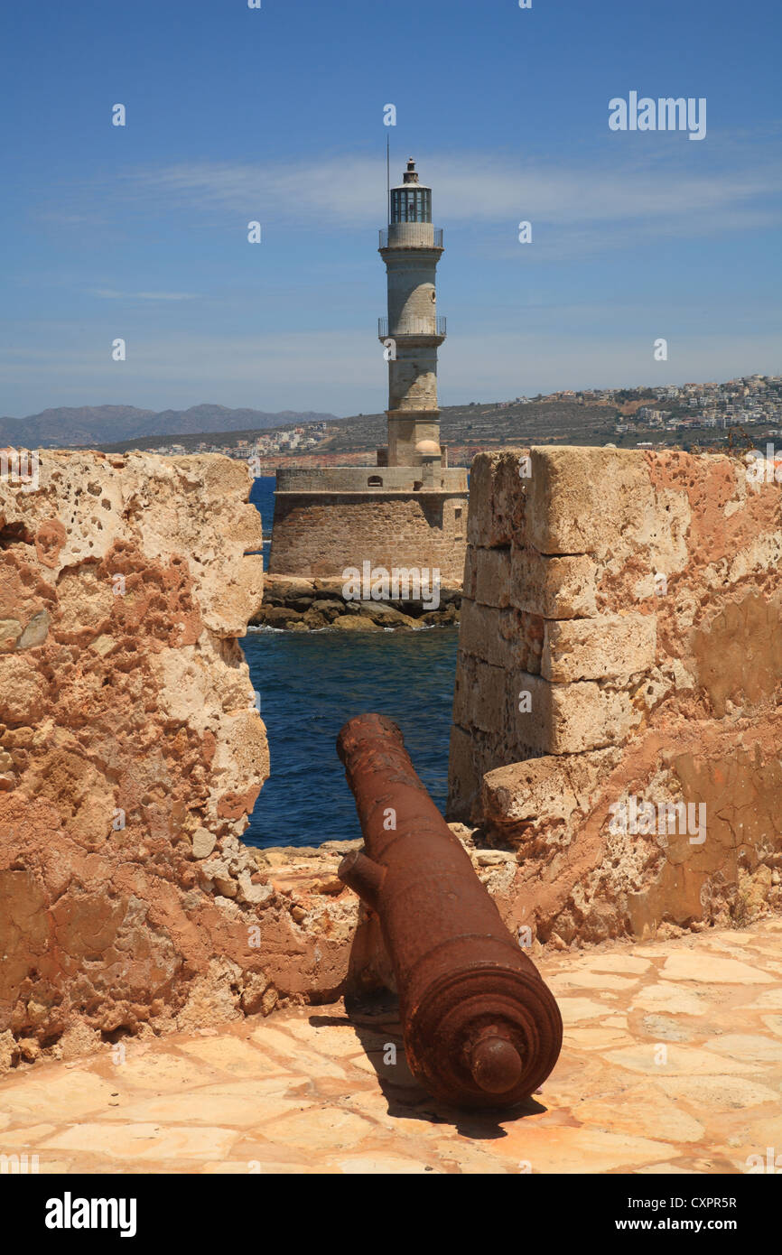 Cannon and view from inside the Firka Fortress to the Venetian Lighthouse,  Hania/Chania, Crete, Cyclades, Greece, Stock Photo