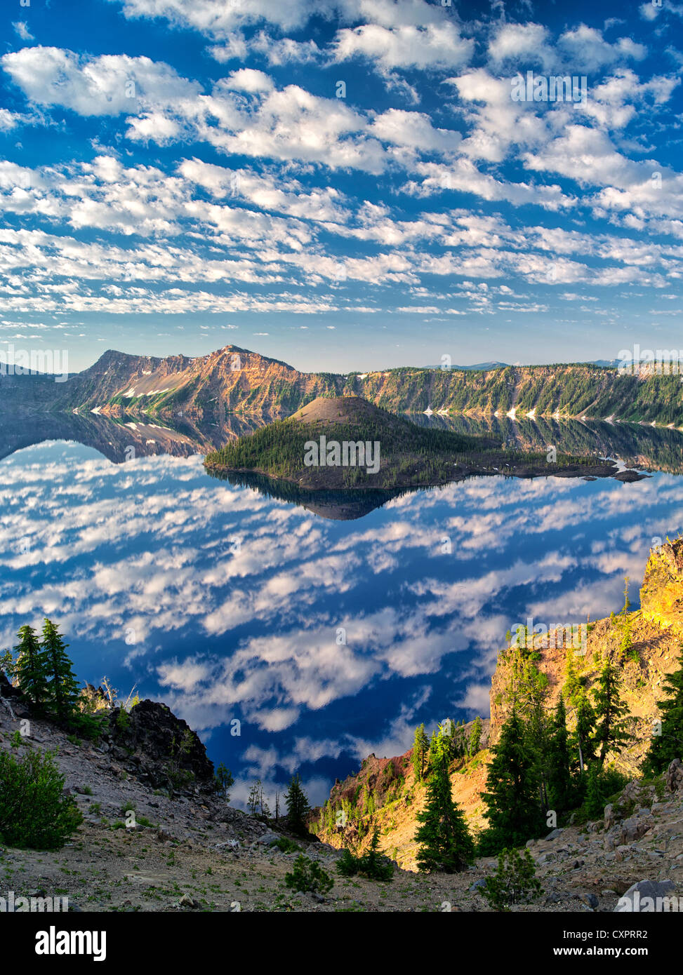 Puffy cloud reflection, Crater Lake and Wizard Island. Crater Lake National Park, Oregon Stock Photo