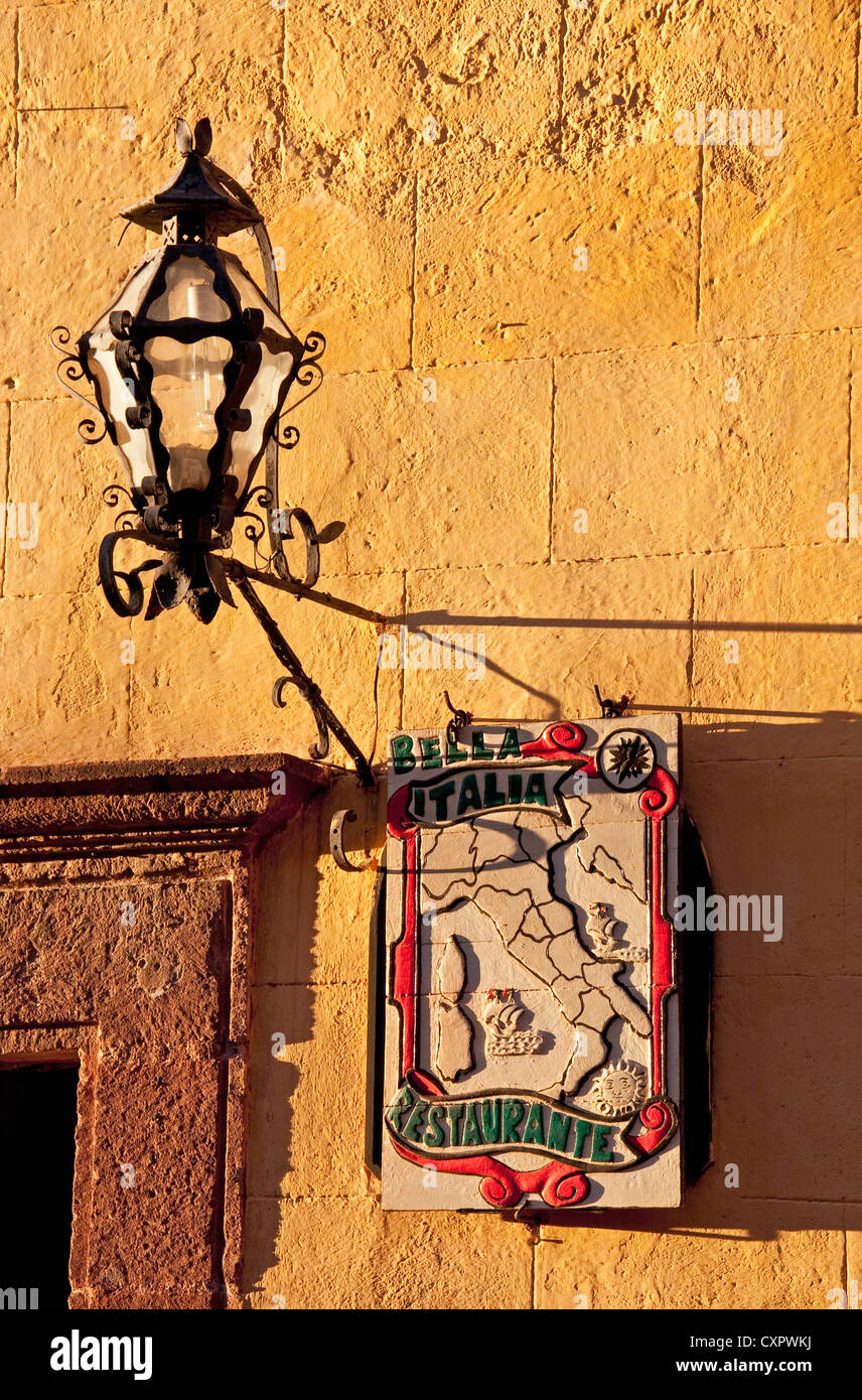 San Miguel de Allende lamp and sign for Bella Italia Restaurante near El Jardin central square Stock Photo