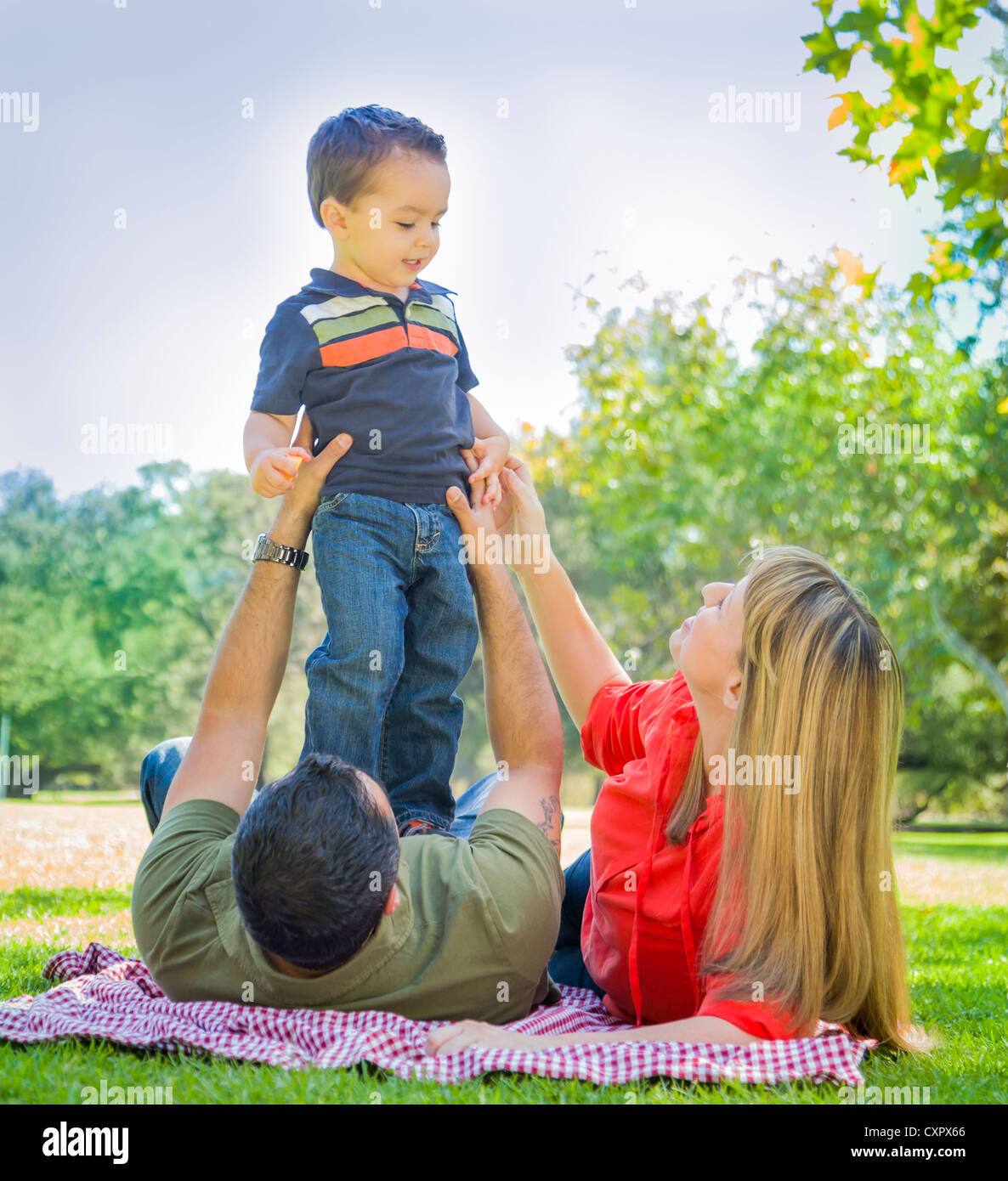Happy Mixed Race Family Enjoy a Day at The Park Together Stock Photo ...