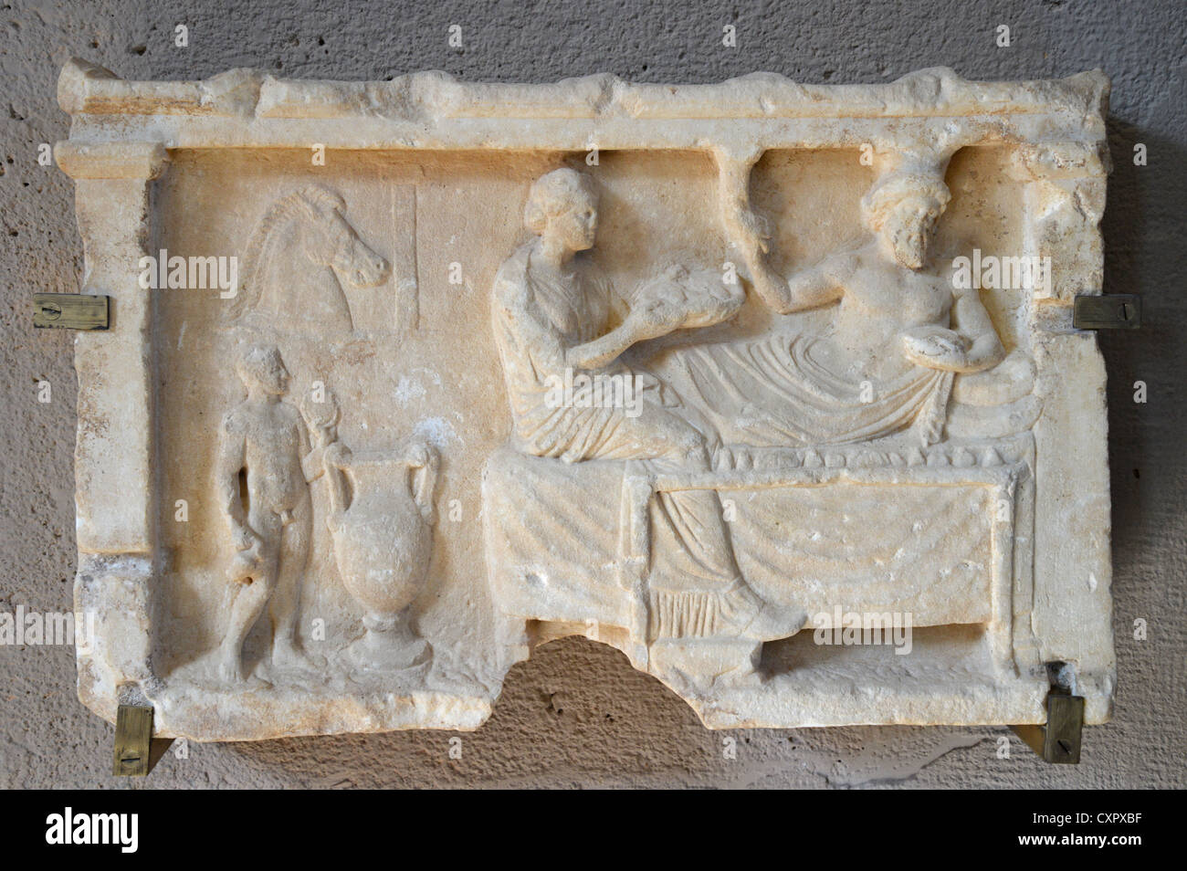 Votive Relief of funeral in The Archaeological Museum, Ancient Corinth, Corinth Municipality, Peloponnese Region, Greece Stock Photo