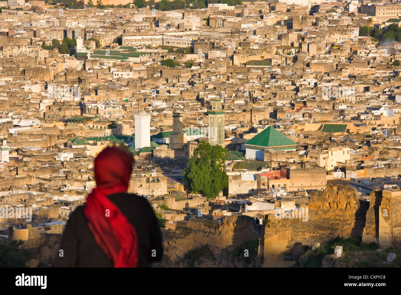 Woman Looking At Cityscape Of Old Medina Dominated By The Stock Photo Alamy