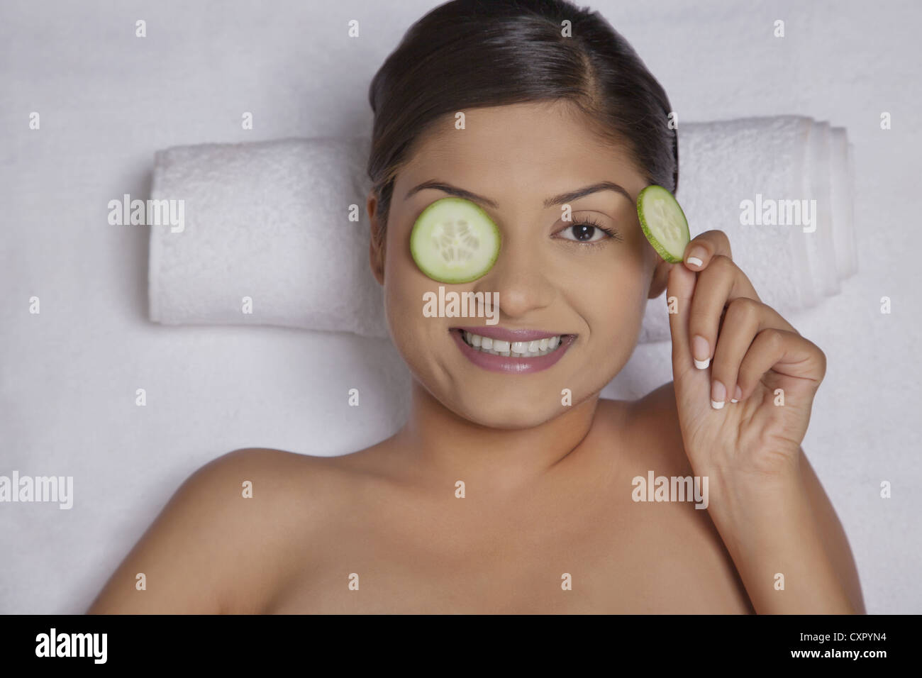 Cucumber slices on a woman's eyes Stock Photo Alamy